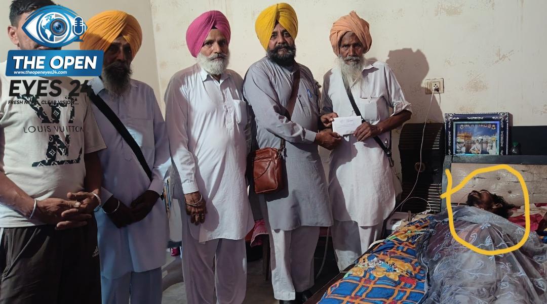 ਫੋਟੋ ਕੈਪਸ਼ਨ:  ਪੀੜਤ ਨੌਜਵਾਨ ਦੇ ਪਿਤਾ ਬਿੱਕਰ ਸਿੰਘ ਨੂੰ ਸਹਾਇਤਾ ਰਾਸ਼ੀ ਭੇਂਟ ਕਰਦੇ ਸਮਾਜ ਸੇਵੀ ਭਾਨ ਸਿੰਘ ਜੱਸੀ ਅਤੇ ਹੋਰ ਹਾਜ਼ਰ ਸੱਜਣ।